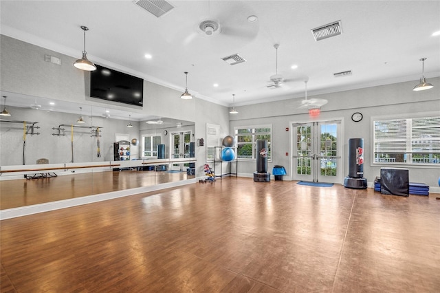 workout area featuring french doors, ceiling fan, and crown molding