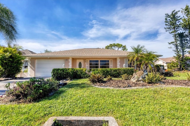 ranch-style home with a front yard and a garage