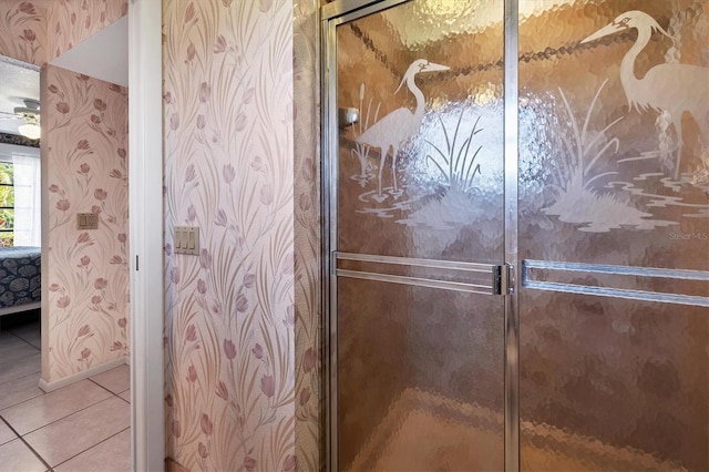 bathroom featuring tile patterned flooring and a shower with door