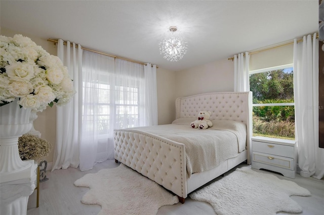 bedroom with carpet flooring and an inviting chandelier