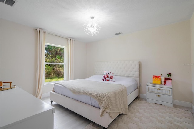 bedroom with an inviting chandelier