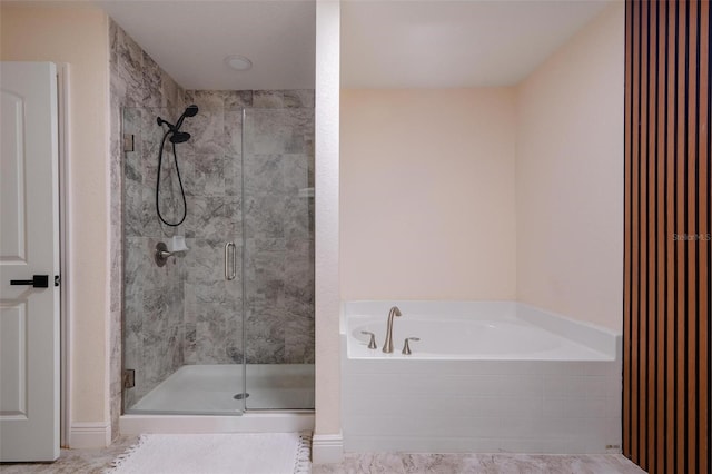 bathroom with shower with separate bathtub