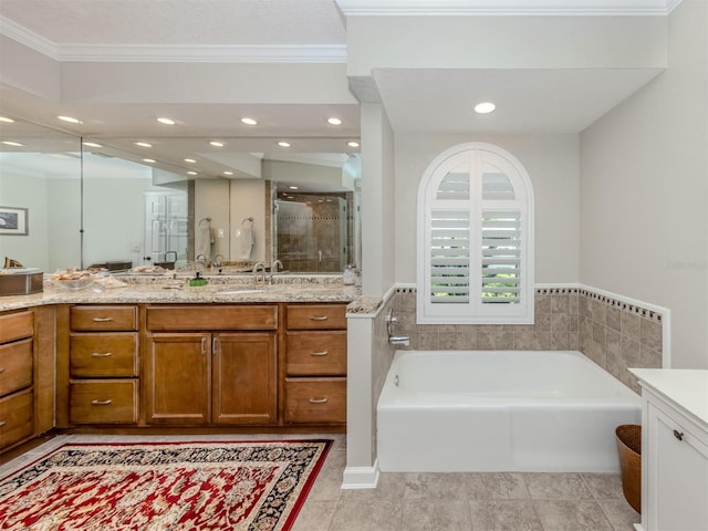 bathroom featuring tile patterned floors, vanity, separate shower and tub, and crown molding