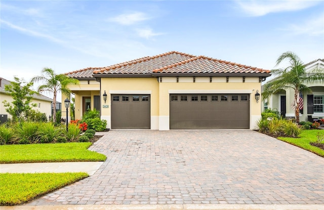 mediterranean / spanish house featuring a garage