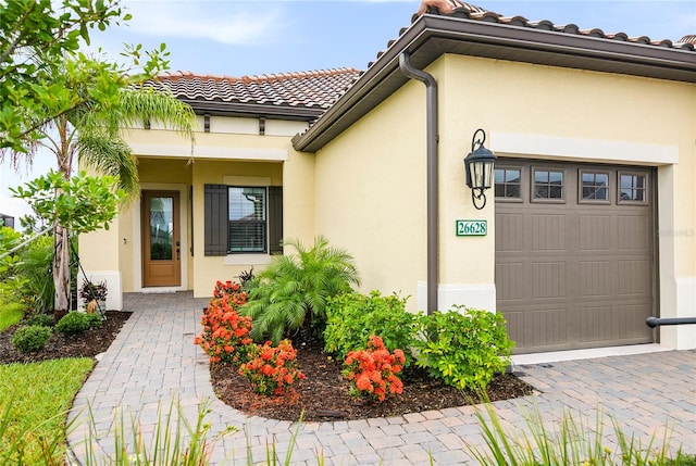 entrance to property featuring a garage