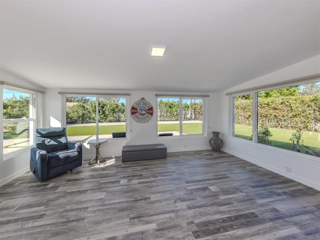 sunroom with a wealth of natural light and lofted ceiling