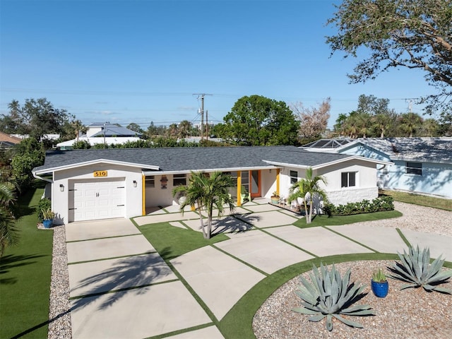 ranch-style house featuring a garage