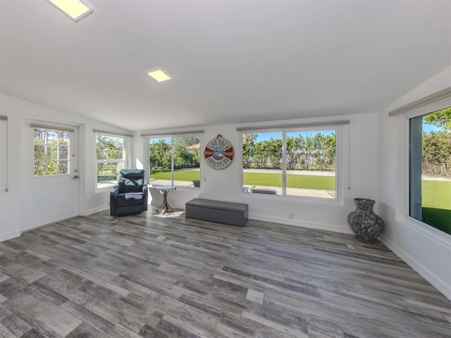 unfurnished sunroom featuring plenty of natural light and lofted ceiling