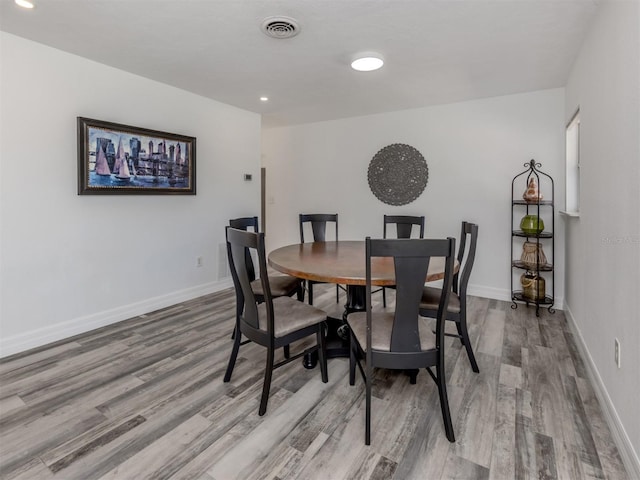 dining room with hardwood / wood-style floors