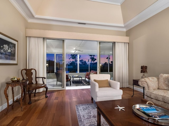 living room with crown molding, ceiling fan, and wood-type flooring