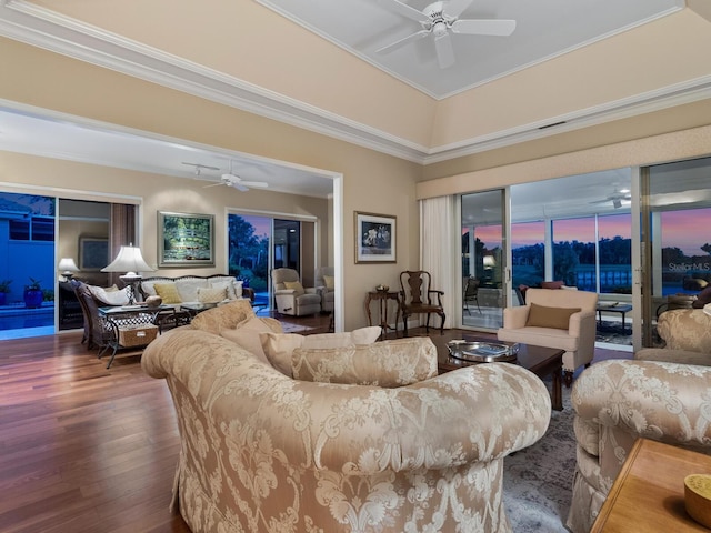 living room with ceiling fan, dark hardwood / wood-style floors, and ornamental molding