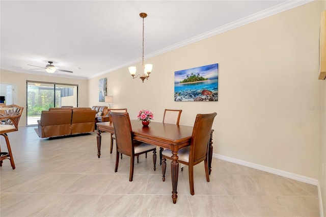 tiled dining room with ceiling fan with notable chandelier and ornamental molding