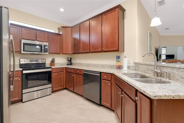 kitchen with crown molding, sink, hanging light fixtures, light stone countertops, and stainless steel appliances