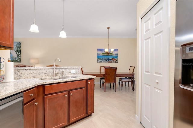 kitchen with appliances with stainless steel finishes, light stone counters, ornamental molding, sink, and hanging light fixtures