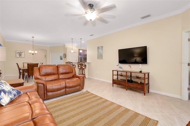 living room featuring light tile patterned floors, ceiling fan with notable chandelier, and ornamental molding