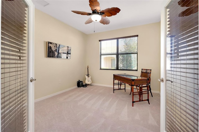 carpeted office with ceiling fan