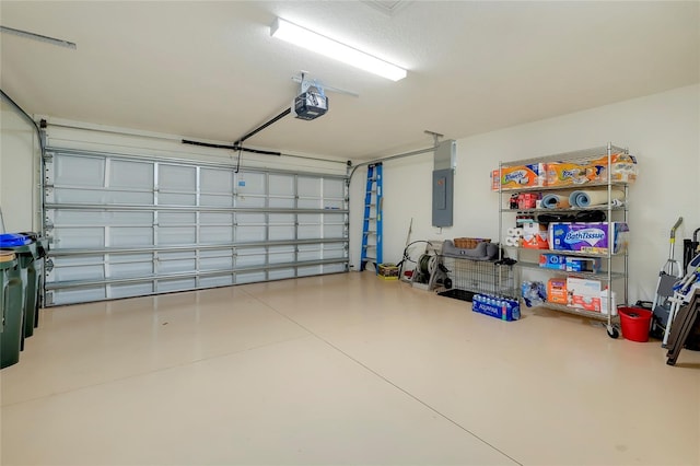 garage featuring electric panel and a garage door opener