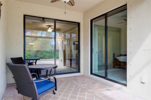 sunroom / solarium with ceiling fan