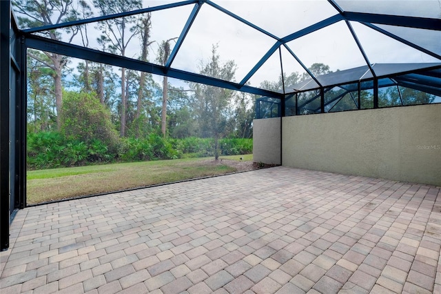 view of patio / terrace featuring glass enclosure