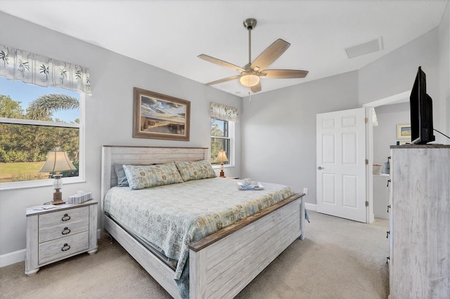 bedroom featuring ceiling fan and light carpet