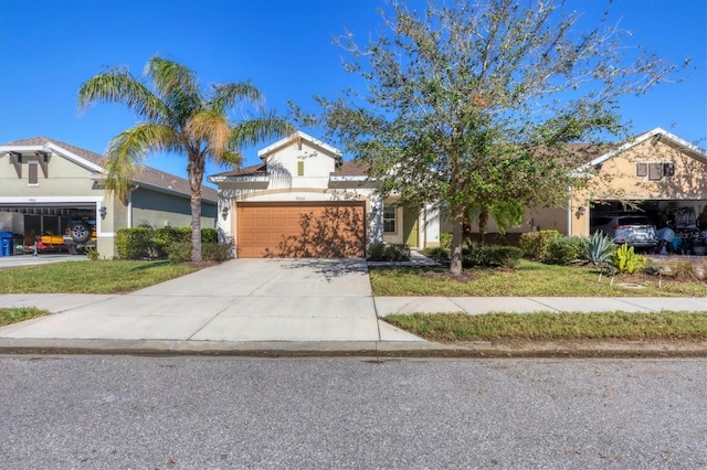 view of front of property featuring a front yard and a garage