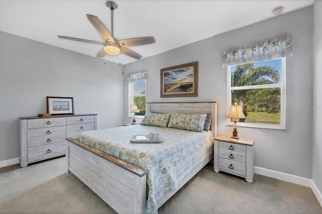 bedroom with light colored carpet and ceiling fan