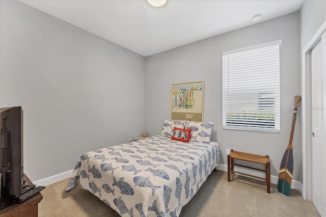 bedroom with light colored carpet