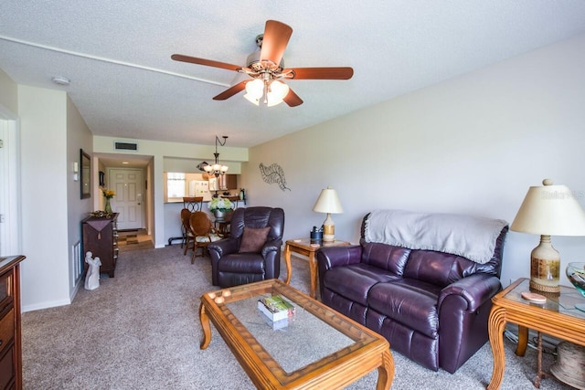 living room with light carpet, a textured ceiling, and ceiling fan with notable chandelier