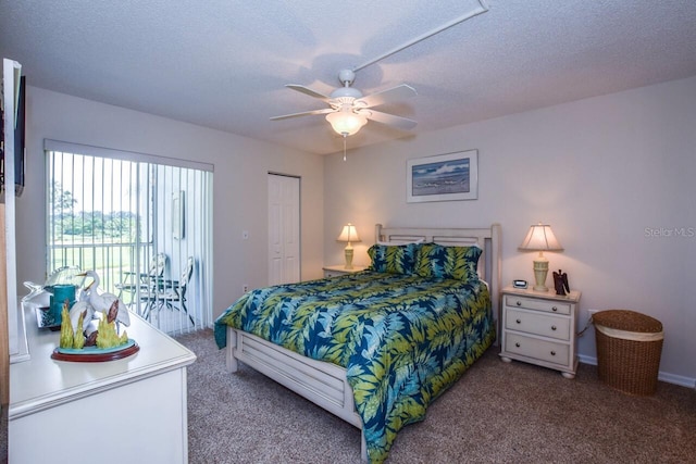 carpeted bedroom featuring ceiling fan, a textured ceiling, and a closet