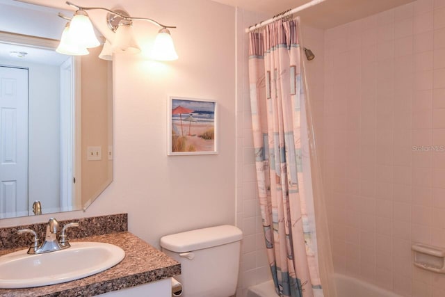 full bathroom featuring shower / bath combo, toilet, and vanity