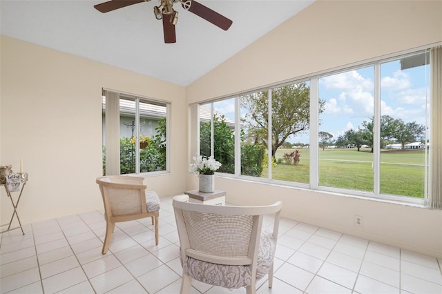 sunroom / solarium with ceiling fan and vaulted ceiling