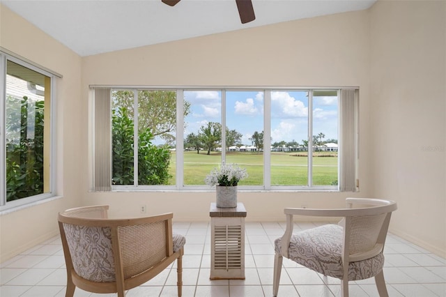 sunroom with ceiling fan, a healthy amount of sunlight, and vaulted ceiling