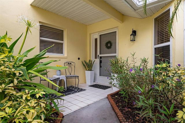 property entrance with a patio