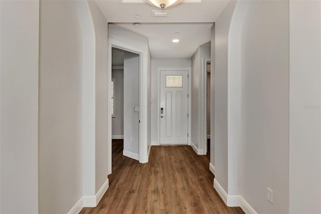 830 The Esplanade N Unit 203, Venice, FL 34285 - corridor with baseboards and wood finished floors