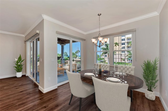 830 The Esplanade N Unit 203, Venice, FL 34285 - dining room featuring dark wood-style floors, baseboards, crown molding, and a chandelier