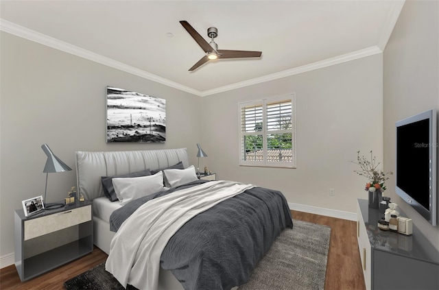 bedroom with crown molding, ceiling fan, and dark wood-type flooring