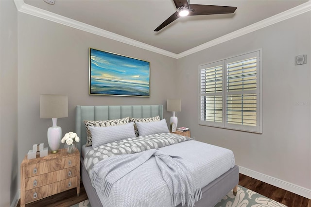 bedroom featuring dark hardwood / wood-style floors, ceiling fan, and ornamental molding