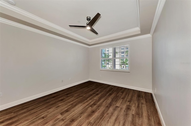 830 The Esplanade N Unit 203, Venice, FL 34285 - empty room with dark wood-type flooring, ceiling fan, baseboards, ornamental molding, and a raised ceiling