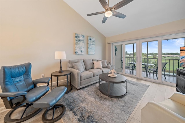 living room with ceiling fan, high vaulted ceiling, and light hardwood / wood-style floors