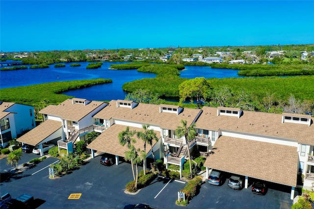 birds eye view of property featuring a water view