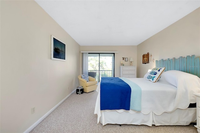 bedroom with access to exterior and carpet floors