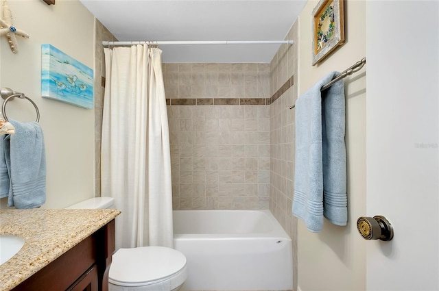 full bathroom featuring vanity, shower / tub combo, and toilet