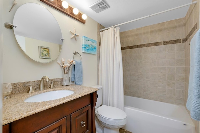 full bathroom featuring vanity, toilet, and shower / tub combo