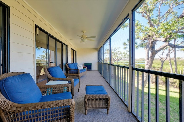 sunroom / solarium with plenty of natural light and ceiling fan