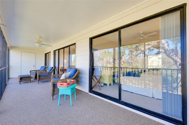 sunroom featuring ceiling fan