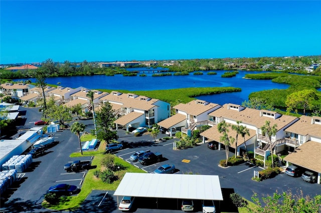 birds eye view of property with a water view