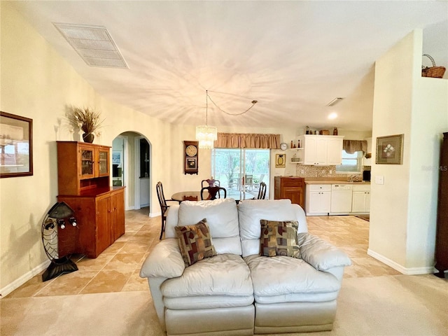 living room featuring a chandelier