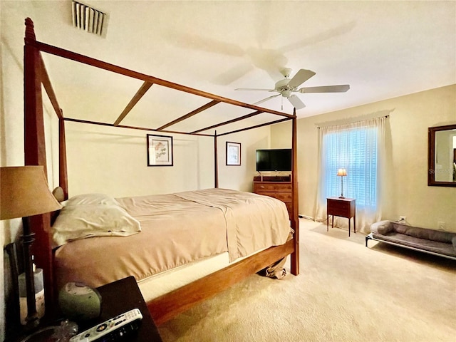 bedroom with ceiling fan and carpet