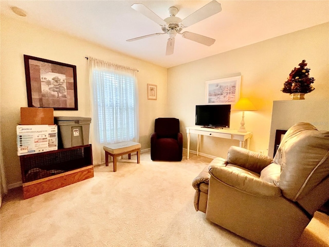 carpeted living room featuring ceiling fan