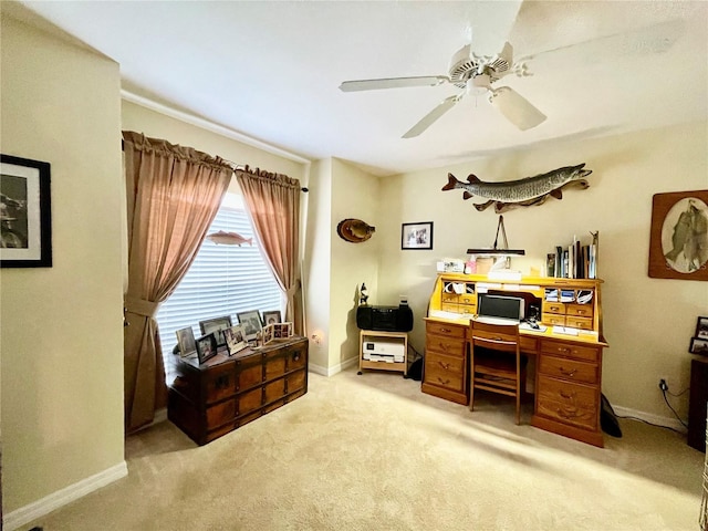 home office with ceiling fan and light carpet